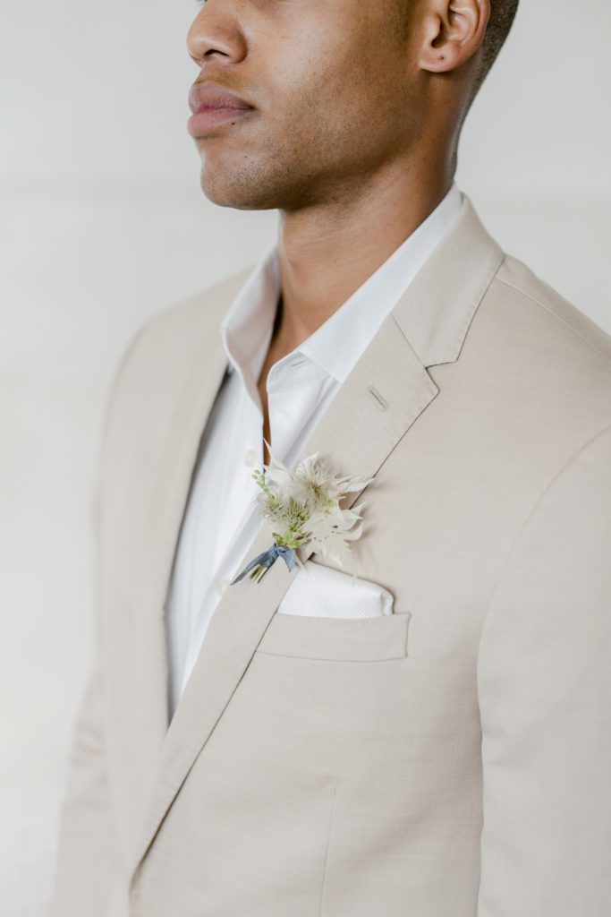 boutonniere on tan suit