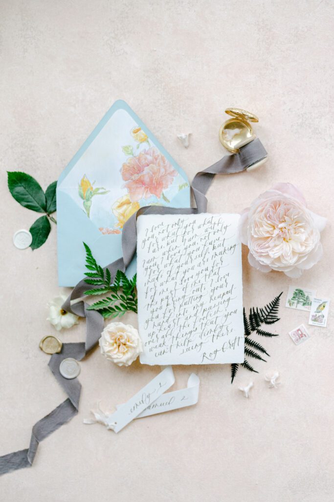Florals and vows flatlay